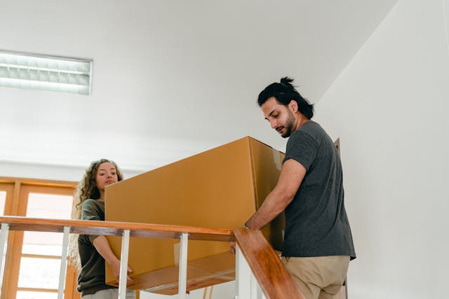 two%20people%20moving%20boxes